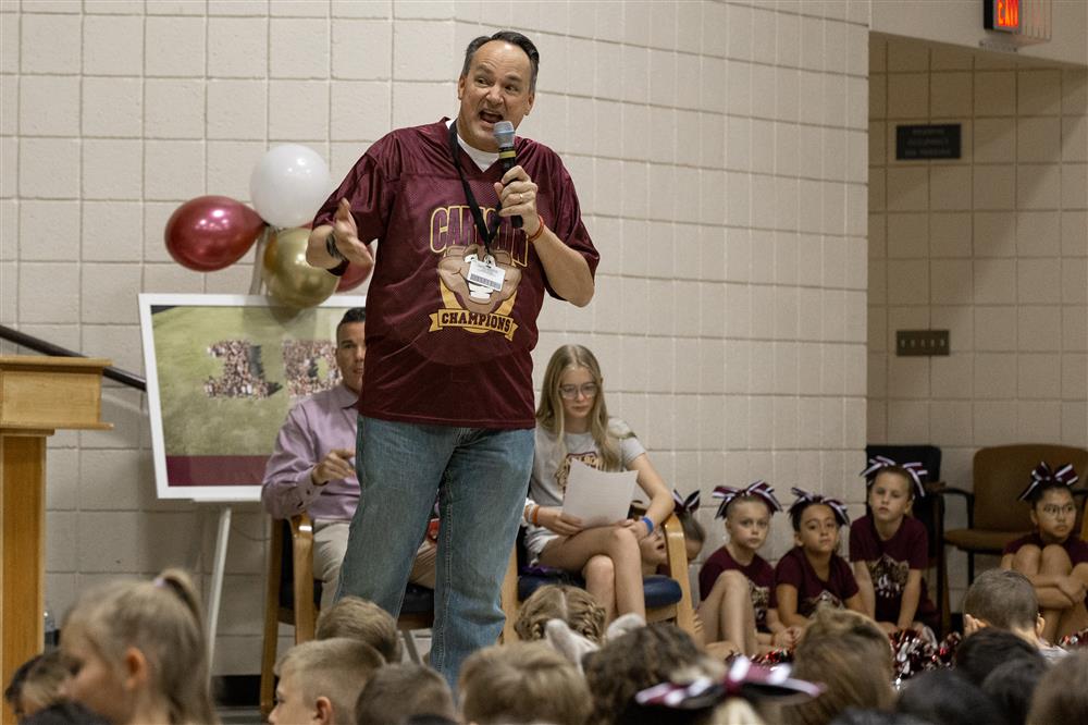 Leo Schlueter chats with students and faculty at Carlson Elementary.